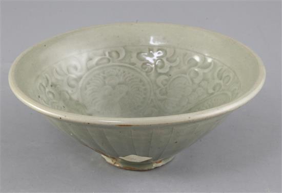 A large Chinese moulded Yaozhou celadon bowl, Jin dynasty (1115-1234), diameter 20.2cm